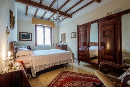 Tempat tidur dalam kamar di La terrazza del Bimbo
