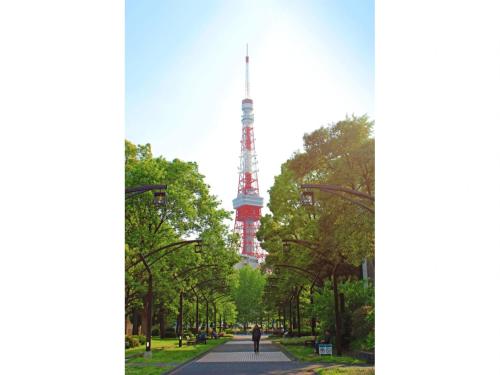 a view of the eiffel tower from the park at KOKO HOTEL Shimbashi Onarimon - formerly Hotel Wing International Shimbashi Onarimon in Tokyo