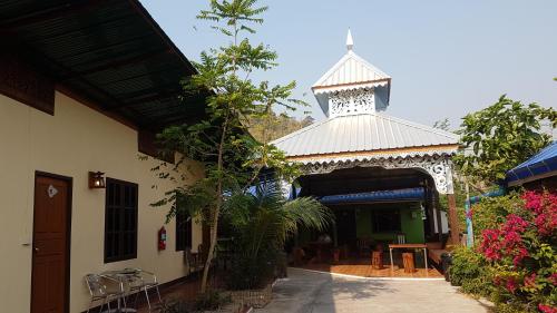 a pavilion with a tower on top of a building at Boondee House in Mae Hong Son