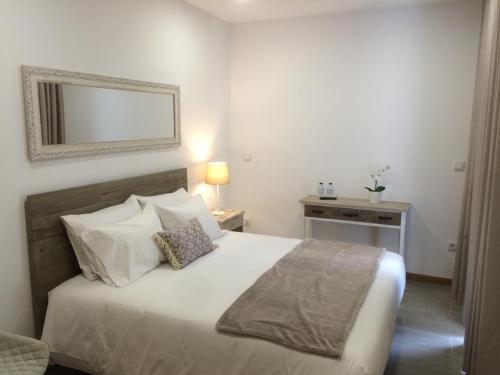 Postel nebo postele na pokoji v ubytování Casinha do Rossio