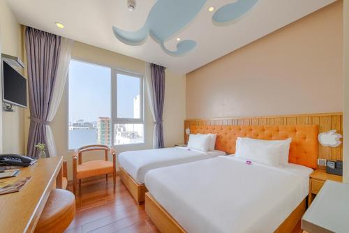 Кровать или кровати в номере SEA QUEEN Hotel