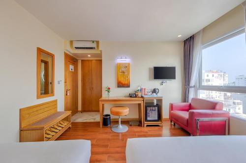 Телевизор и/или развлекательный центр в SEA QUEEN Hotel