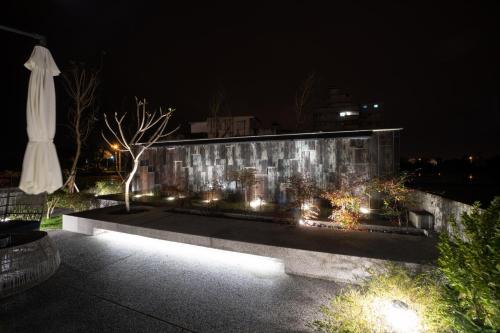 a building with lights on it at night at Tsang Kuo Resort in Wujie