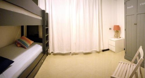 Voodi või voodid majutusasutuse Cinque Terre Moneglia Apartments toas