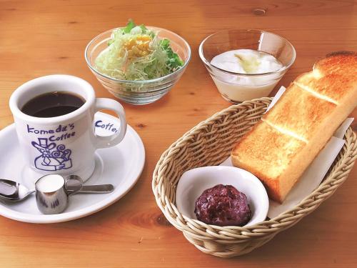 
a table topped with a plate of food and a cup of coffee at APA Hotel Shibuya Dogenzakaue in Tokyo
