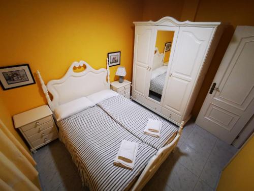 מיטה או מיטות בחדר ב-Apartamento Candil