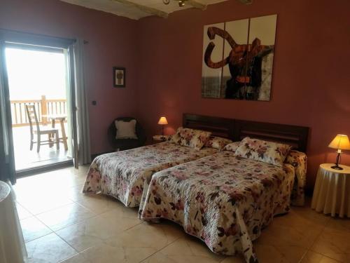 Postel nebo postele na pokoji v ubytování Casa Rural Aristondo Agroturismo