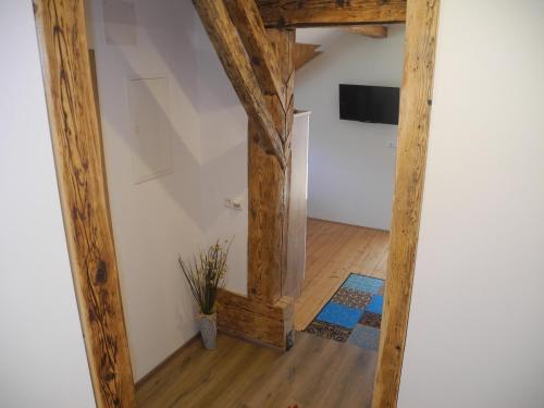 a hallway with wooden beams in a room at Entschleunigungshof Huberbauer in Kötschach