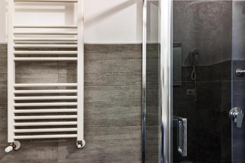 a shower with a white ladder in a bathroom at TRAVEL STATION Bedandbreakfast in Bari