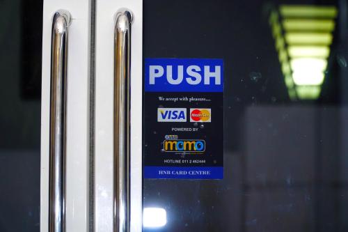 a sign on a door that says push on it at Airport 4 Season Transit Hotel in Katunayake