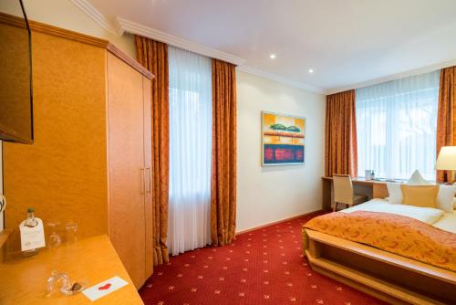 Hotel Asemann Planeggにあるベッド