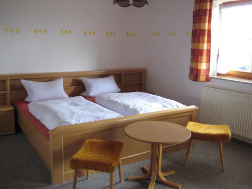 Кровать или кровати в номере Ferienwohnungen Haberberger