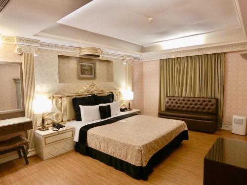Säng eller sängar i ett rum på Discovery Motel - Yonghe