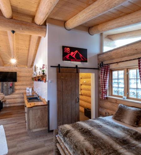 a bedroom with a bed and a sign on the wall at Ferienhof Ellerbeck in Langdorf