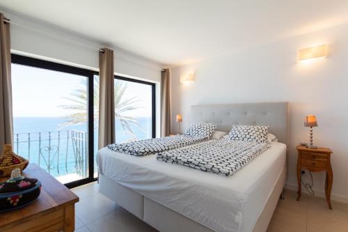 Un pat sau paturi într-o cameră la Monte del Moro