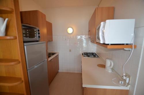 Køkken eller tekøkken på Lignano Sabbiadoro Sea Front