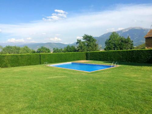a swimming pool in the middle of a yard at OLOPTE I in Olopte