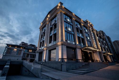 a large building with a clock on the side of it at Aghababyan's Hotel in Yerevan