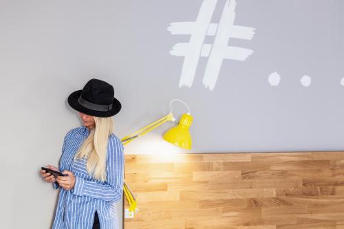 a woman wearing a hat looking at a lamp at Ibis Styles Brindisi in Brindisi