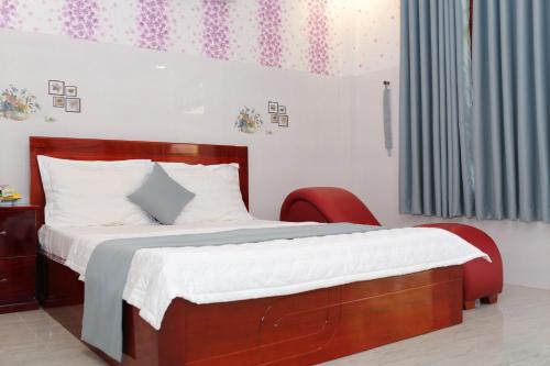 מיטה או מיטות בחדר ב-Thanh Cong Hotel