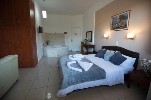 Giường trong phòng chung tại Cavallari Palace Hotel Suites