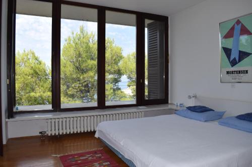 Postel nebo postele na pokoji v ubytování Apartments Polic