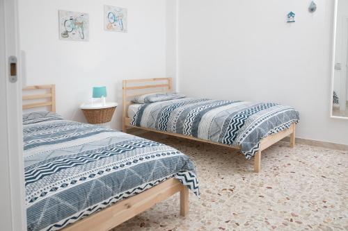 Ліжко або ліжка в номері Appartamento La Finestra sul mare
