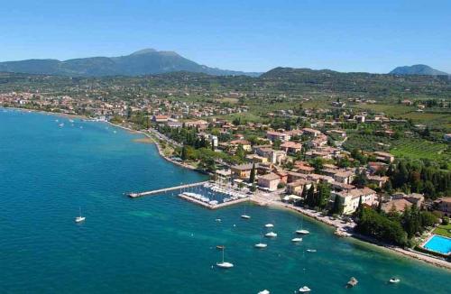 an aerial view of a small harbor with boats in the water at Agriturismo Le Vai in Bardolino