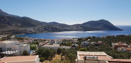 a view of a city and a body of water at Carla Apart Kalkan in Kalkan