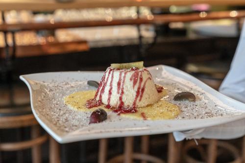 a dessert on a white plate on a table at Hotel Werk II in Bocholt