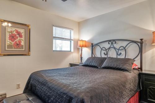 a bedroom with a large bed and a window at Redwood Commons B12 in Angel Fire