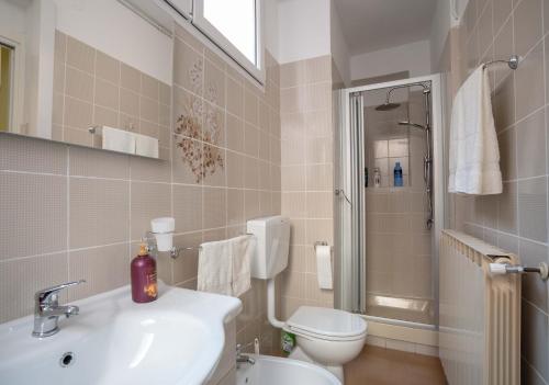 a bathroom with a sink and a toilet at Da Elisa in Riomaggiore