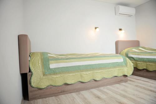 a bedroom with two beds in a room at Lofts - Kaunas airport in Karmėlava