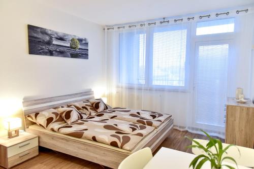 Postel nebo postele na pokoji v ubytování Apartmán-Třeboň-centrum