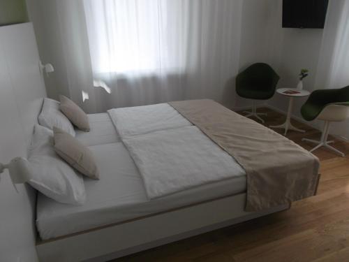 Ένα ή περισσότερα κρεβάτια σε δωμάτιο στο ART Hotel Ufer