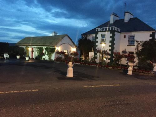 a hotel building with a fire hydrant in front of it at Teresas Cottage in Donegal