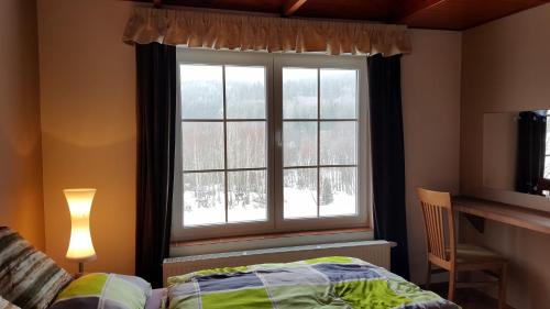 Postel nebo postele na pokoji v ubytování Lipno Apartmany Frymburk III.