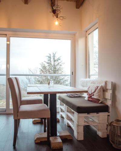 a room with a table and a chair and a window at Natura Glamping in Alcongosta