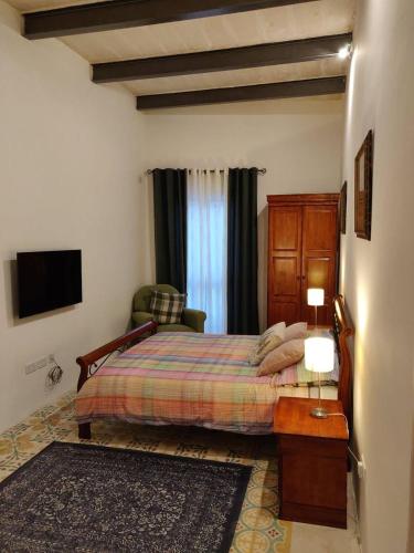 Llit o llits en una habitació de Rons Town House