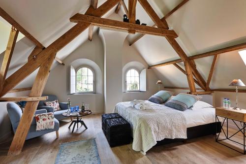 Säng eller sängar i ett rum på De Zonnebrug Dijkhoeve