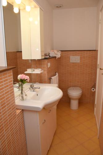a bathroom with a sink and a toilet at Miro B&B in Lecce