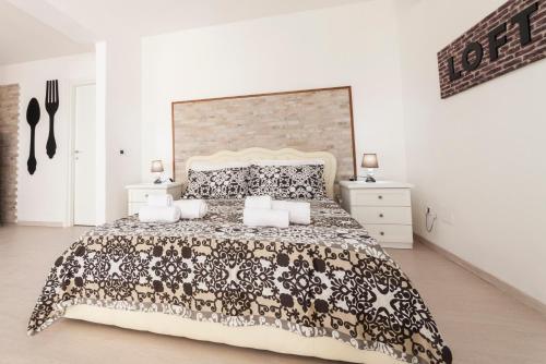 Posteľ alebo postele v izbe v ubytovaní Ortigia Terrace Sea View