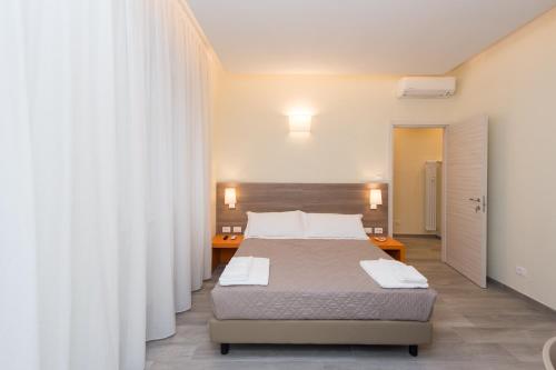 a bedroom with two beds and a large curtain at SAN FELICE 135 - 2 in Bologna