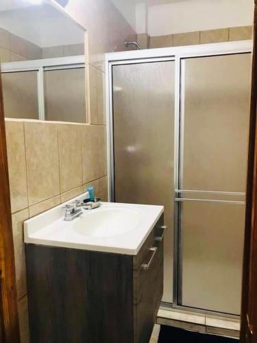 a bathroom with a sink and a shower at Condo de Cortez in Puerto Peñasco