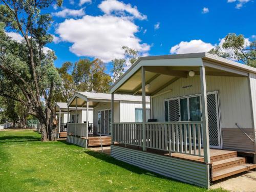 a manufactured home with a porch and a deck at Echo Holiday Parks - Waikerie in Waikerie