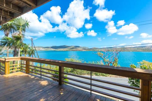 a view from the deck of a house overlooking the water at Oceania Villas in Culebra