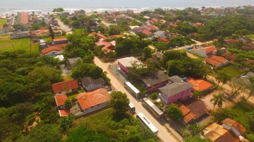 an overhead view of a village with houses and trees at Pousada vila oeste in Itapoa