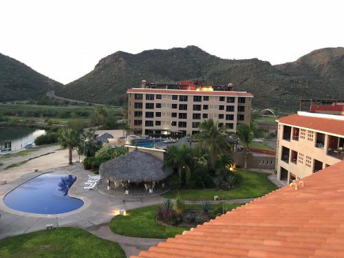 an aerial view of a resort with a swimming pool at Marina Nopolo 104 in Nopoló