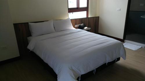Postel nebo postele na pokoji v ubytování Tropical Fish B&B