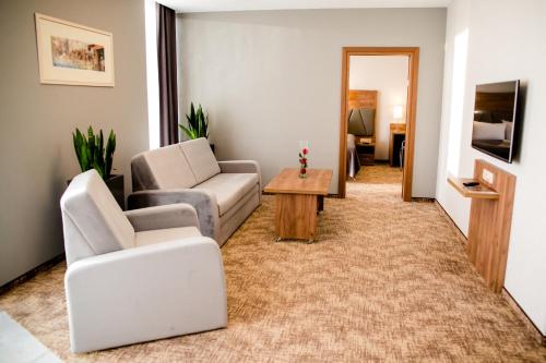 TV a/nebo společenská místnost v ubytování APART HOTEL 12